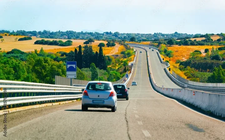 Car on the road. Transport driving on the highway of Europe. View on motorway. Mixed media.