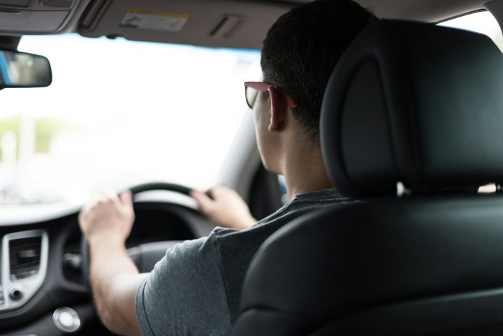 Man driving car during daytime stockpack unsplash